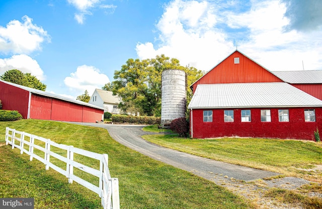 4116 Harford Creamery Rd, White Hall, MD 21161 - view of property exterior with an outbuilding, fence, and a yard