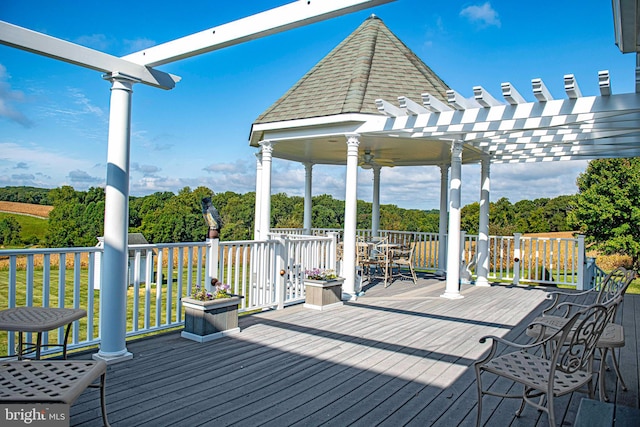 wooden deck featuring a pergola