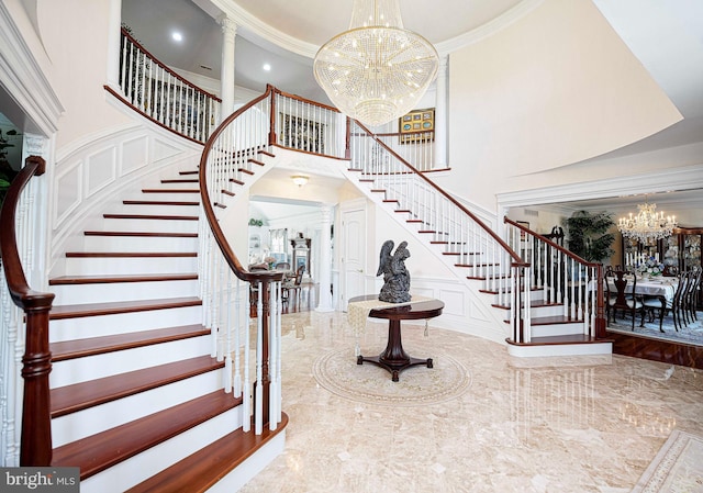 4116 Harford Creamery Rd, White Hall, MD 21161 - foyer entrance featuring a high ceiling, a decorative wall, a chandelier, stairs, and ornate columns