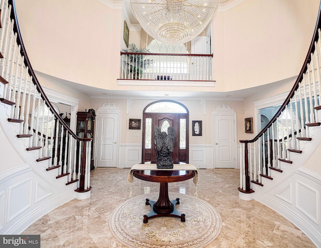 4116 Harford Creamery Rd, White Hall, MD 21161 - entryway featuring a towering ceiling, a decorative wall, a notable chandelier, and stairway