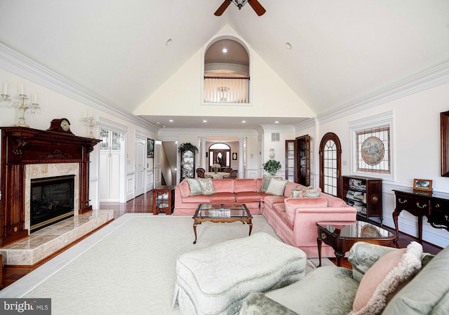 4116 Harford Creamery Rd, White Hall, MD 21161 - living room with a high end fireplace, a ceiling fan, wainscoting, and a decorative wall