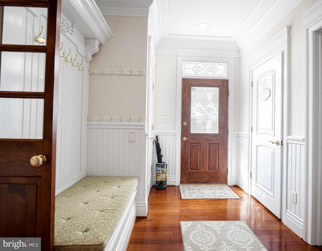 4116 Harford Creamery Rd, White Hall, MD 21161 - foyer with crown molding, a decorative wall, wood finished floors, and a wainscoted wall
