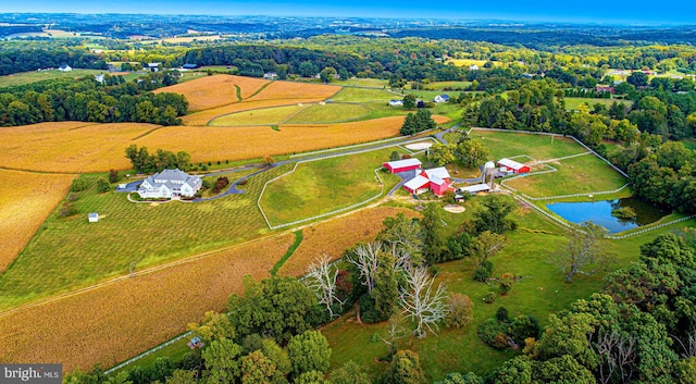 drone / aerial view with a water view and a rural view