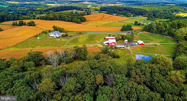 drone / aerial view featuring a water view and a rural view