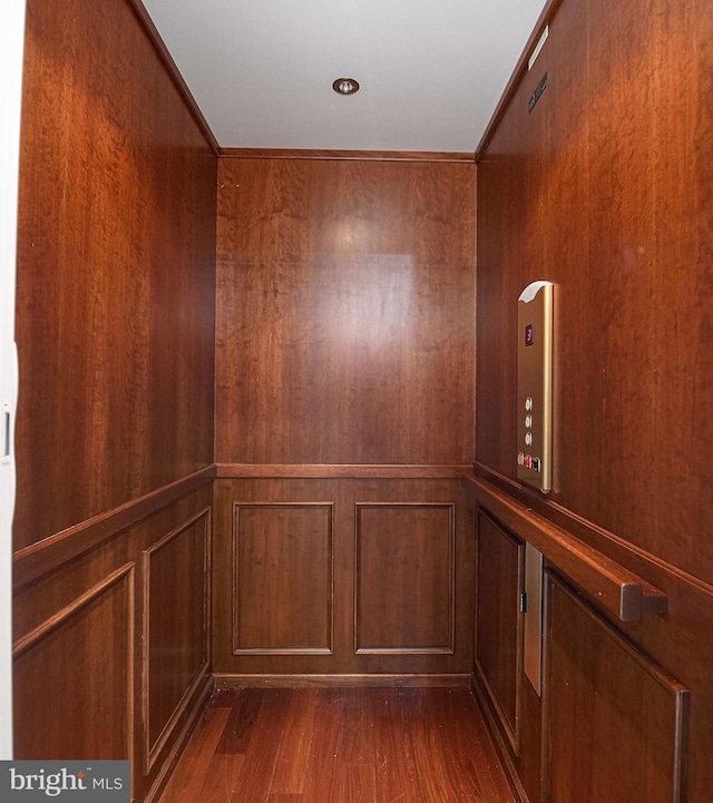 4116 Harford Creamery Rd, White Hall, MD 21161 - room details featuring arched walkways, wood walls, elevator, and wood finished floors