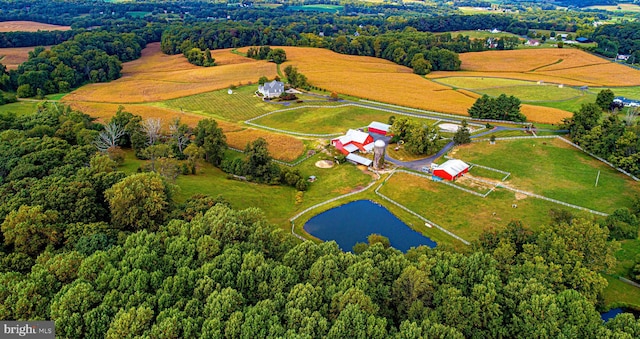 bird's eye view with a water view and a rural view