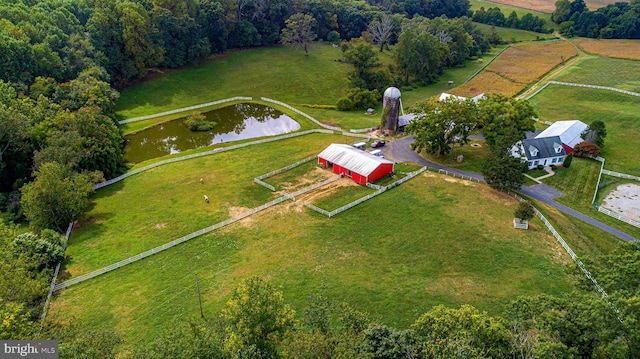 bird's eye view with a water view and a rural view