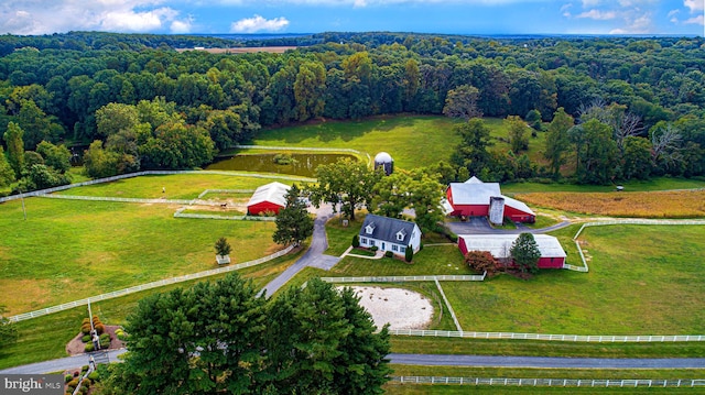 birds eye view of property with a rural view