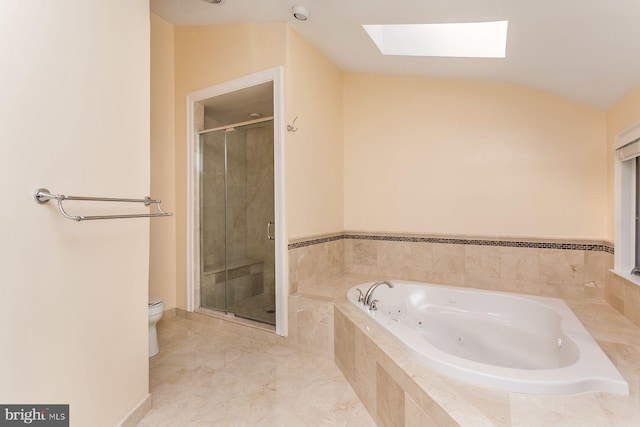 bathroom featuring lofted ceiling with skylight, toilet, independent shower and bath, and tile patterned floors