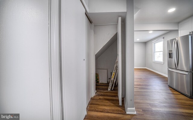 stairway featuring wood-type flooring