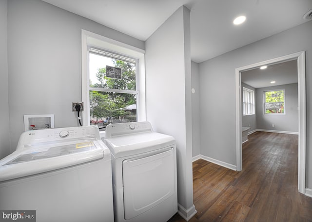 laundry area with washer and dryer and dark hardwood / wood-style floors