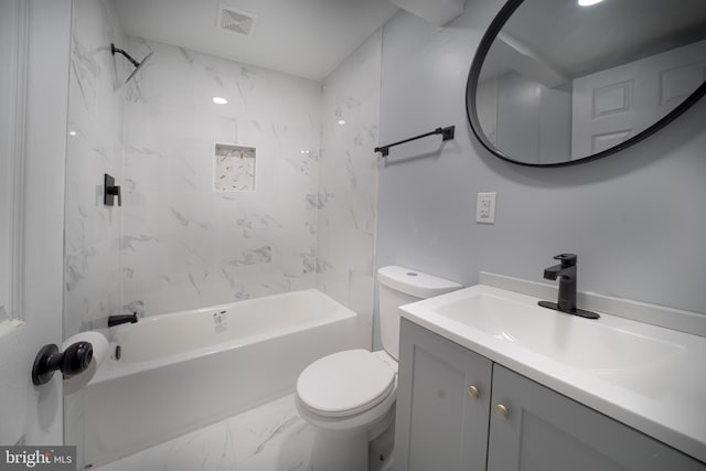 full bathroom with tiled shower / bath combo, toilet, and vanity