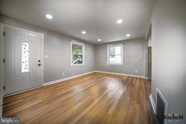 entrance foyer with hardwood / wood-style floors