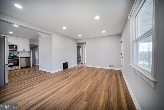 unfurnished living room with light wood-type flooring