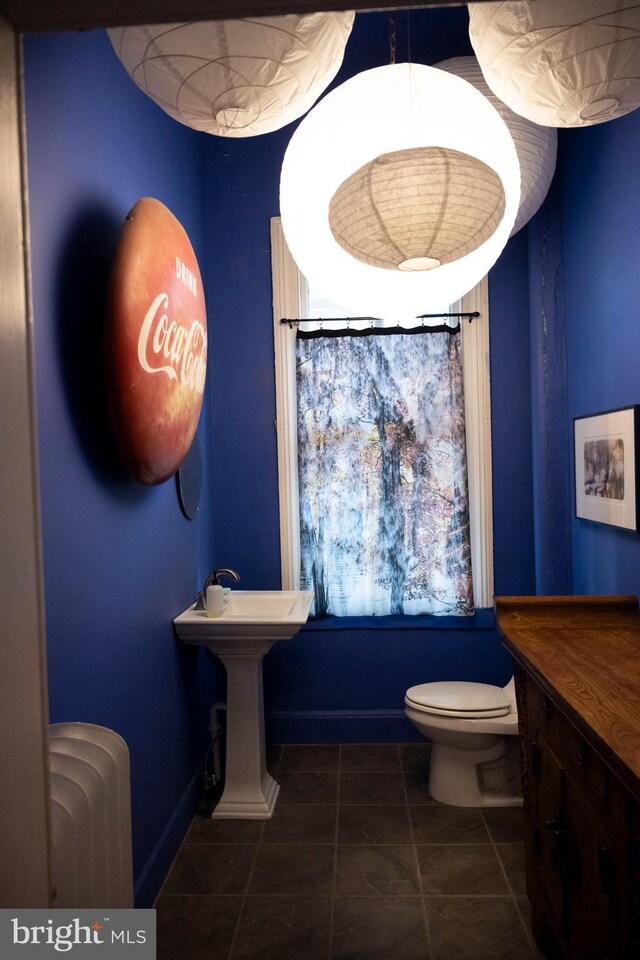 19 S Stricker St, Baltimore, MD 21223 - bathroom featuring tile patterned floors and toilet