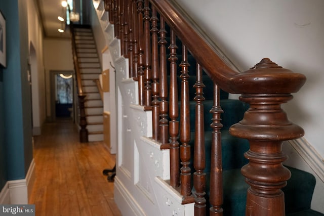 19 S Stricker St, Baltimore, MD 21223 - stairway featuring wood finished floors