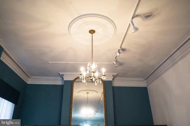 19 S Stricker St, Baltimore, MD 21223 - interior details with rail lighting and a chandelier
