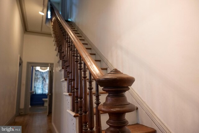 19 S Stricker St, Baltimore, MD 21223 - stairs featuring baseboards and wood finished floors