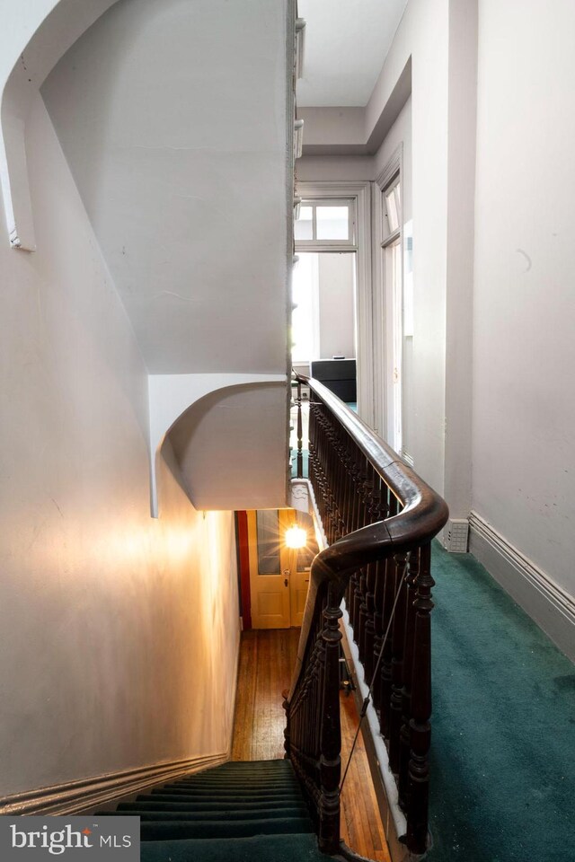 19 S Stricker St, Baltimore, MD 21223 - staircase with arched walkways and baseboards
