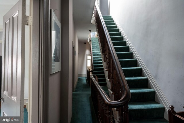 19 S Stricker St, Baltimore, MD 21223 - staircase featuring carpet floors