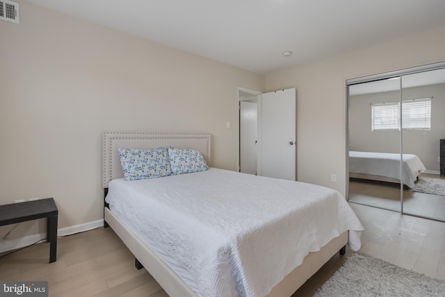 bedroom featuring a closet and light hardwood / wood-style floors