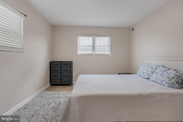 bedroom with light wood-type flooring