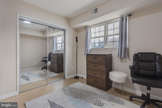 bedroom featuring light wood-type flooring and a closet