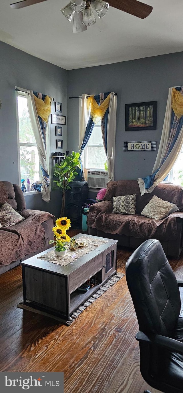 living room featuring ceiling fan, a healthy amount of sunlight, and hardwood / wood-style flooring