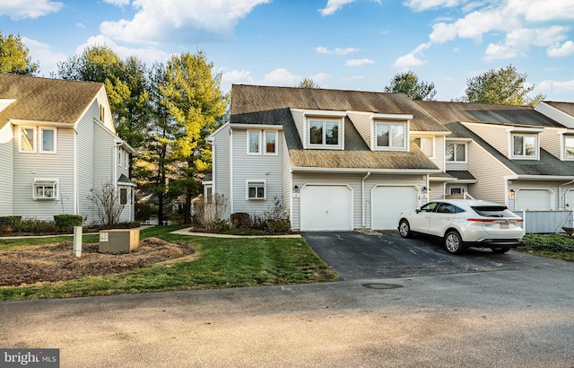 townhome / multi-family property featuring a garage