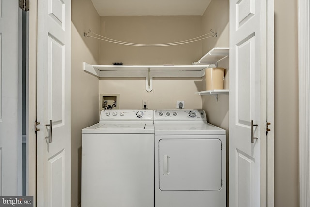 washroom with separate washer and dryer