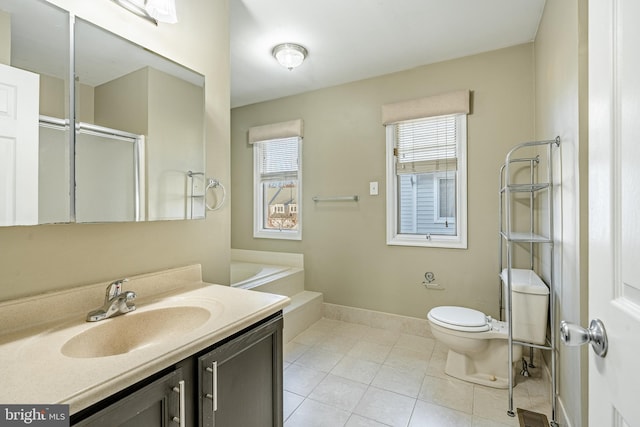 full bathroom with plus walk in shower, tile patterned flooring, vanity, and toilet