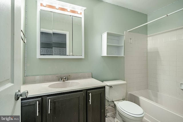 full bathroom featuring vanity, toilet, and tiled shower / bath combo