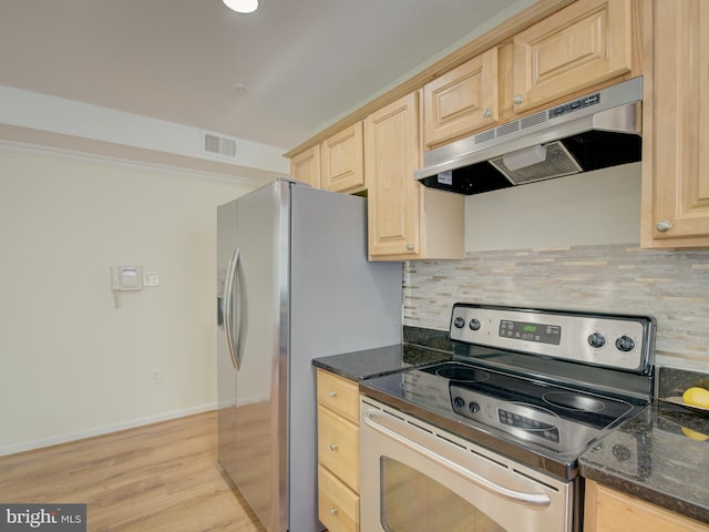 kitchen featuring backsplash, light wood-type flooring, dark stone counters, light brown cabinetry, and stainless steel electric stove