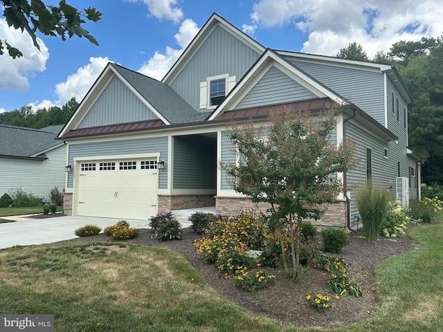 craftsman inspired home featuring covered porch, a front yard, and a garage