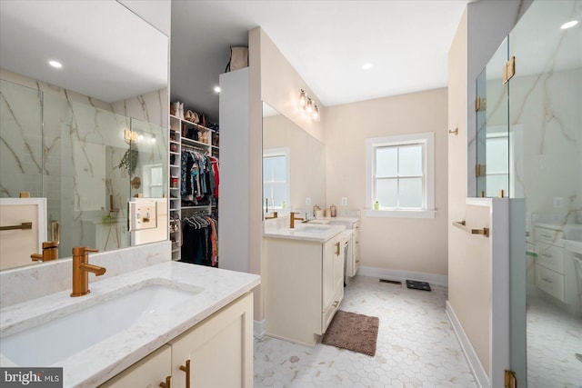 bathroom with an enclosed shower and vanity