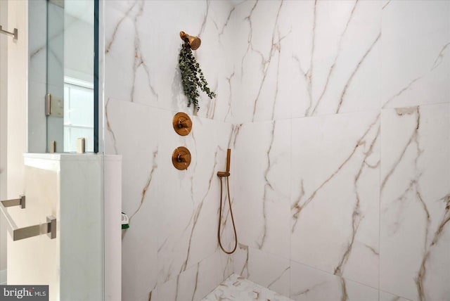 room details with a marble finish shower