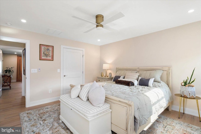 bedroom featuring light wood-type flooring, ceiling fan, baseboards, and recessed lighting