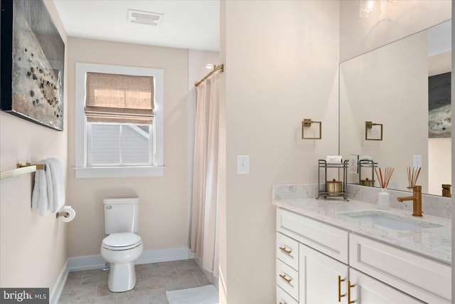 bathroom featuring vanity, toilet, a shower with curtain, and tile patterned flooring