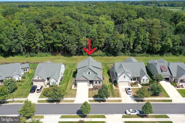 bird's eye view featuring a residential view and a forest view