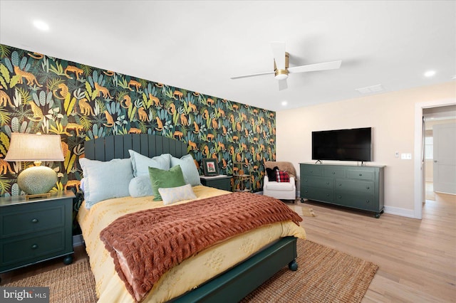 bedroom with light wood-type flooring and ceiling fan