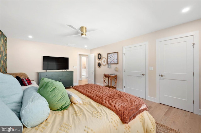 bedroom featuring light hardwood / wood-style flooring and ceiling fan