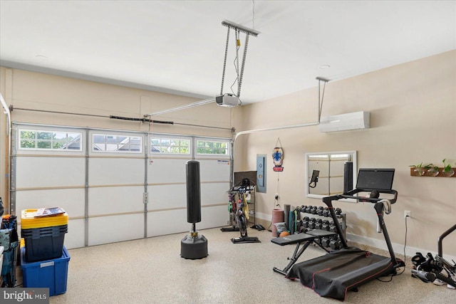 exercise area featuring a garage, a wall mounted air conditioner, and electric panel