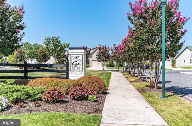 view of home's community with fence