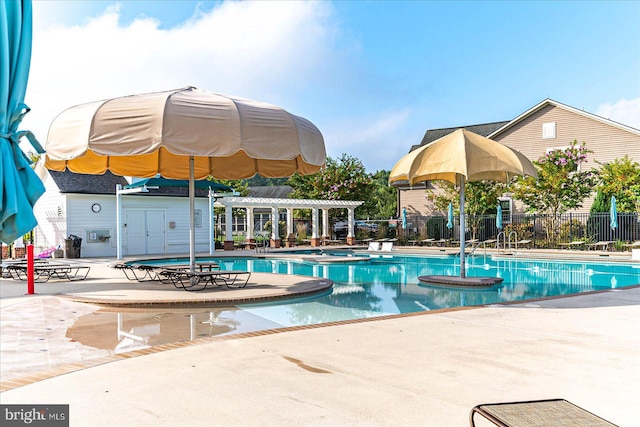 view of swimming pool with a jacuzzi and a patio