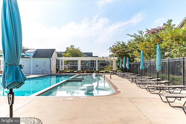 view of swimming pool with a patio area