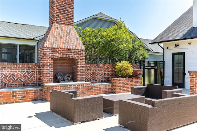 view of patio / terrace featuring an outdoor living space with a fireplace