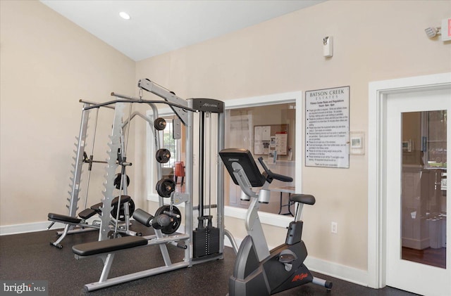 exercise area featuring recessed lighting and baseboards