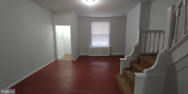 foyer with dark hardwood / wood-style floors