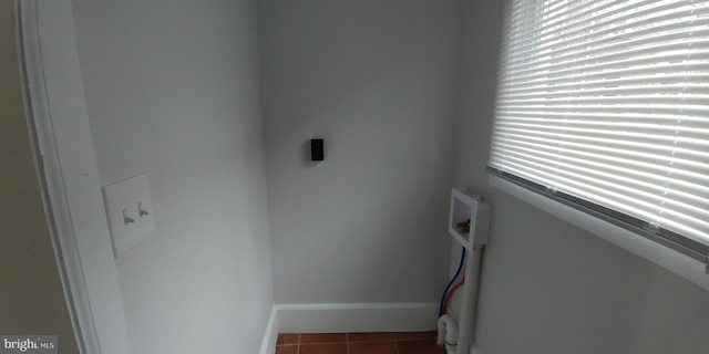 staircase featuring tile patterned flooring