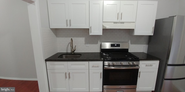 kitchen with appliances with stainless steel finishes, dark hardwood / wood-style flooring, exhaust hood, and white cabinets